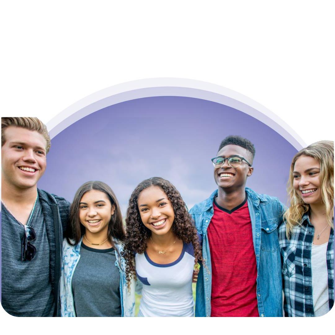 Group of teens smiling with a purple background